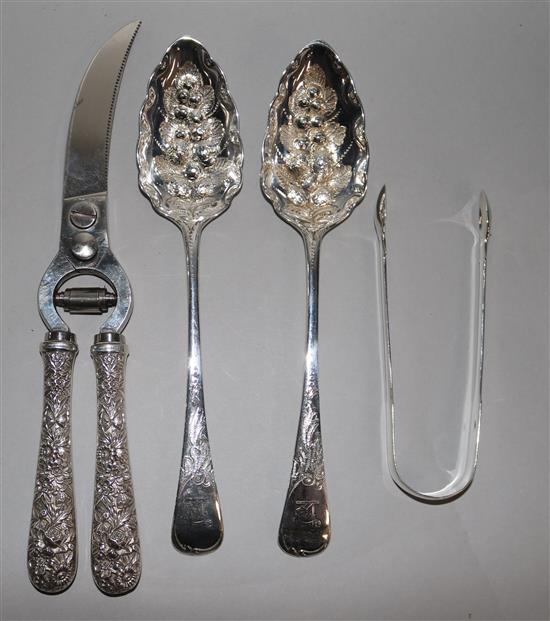 A pair of George III silver berry spoons, a pair of sugar tongs and a pair of American white metal handled shears